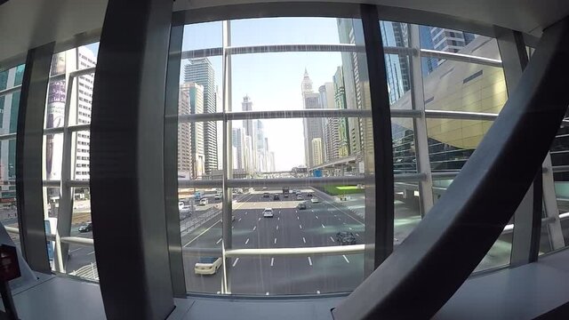 This is a dolly shot of Sheikh Zayed Road using the walkalator of the MRT in Dubai.