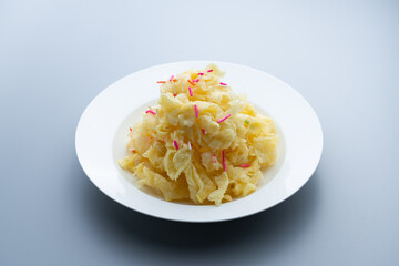 Chinese traditional Beijing snack with pastry fried with ginger juice and sugar. Old Beijing ginger sauce fork. Old Beijing snack fork. 