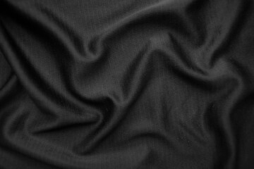 Background texture black cloth. Abstract dark wavy soft. Fabric is wrinkled. Fashion luxury style.