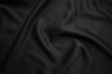 Background texture black cloth. Abstract dark wavy soft. Fabric is wrinkled. Fashion luxury style.