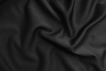 Background texture black cloth. Abstract dark wavy soft. Fabric is wrinkled. Fashion luxury style.