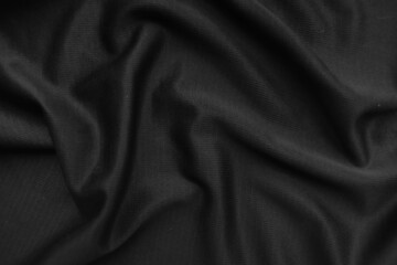 Background texture black cloth. Abstract dark wavy soft. Fabric is wrinkled. Fashion luxury style.