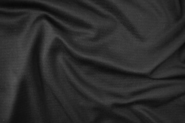 Background texture black cloth. Abstract dark wavy soft. Fabric is wrinkled. Fashion luxury style.