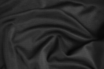 Background texture black cloth. Abstract dark wavy soft. Fabric is wrinkled. Fashion luxury style.