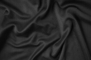 Background texture black cloth. Abstract dark wavy soft. Fabric is wrinkled. Fashion luxury style.