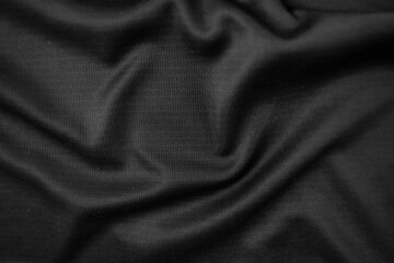 Background texture black cloth. Abstract dark wavy soft. Fabric is wrinkled. Fashion luxury style.