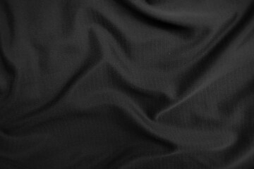 Background texture black cloth. Abstract dark wavy soft. Fabric is wrinkled. Fashion luxury style.