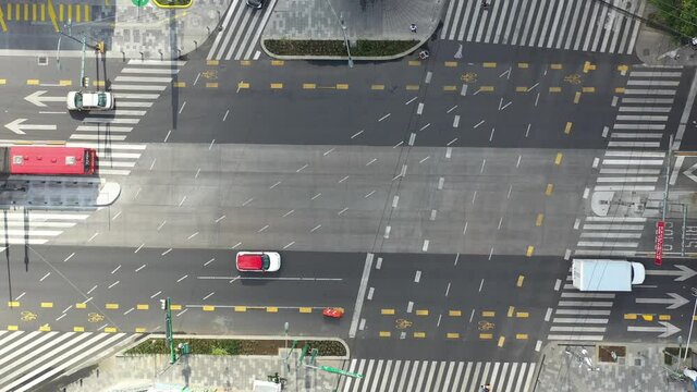 Aerial top down view of Metrobus buses crossing Insurgentes Avenue in Mexico City