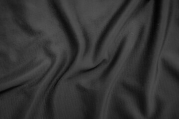 Background texture black cloth. Abstract dark wavy soft. Fabric is wrinkled. Fashion luxury style.