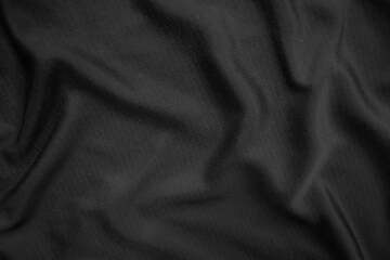 Background texture black cloth. Abstract dark wavy soft. Fabric is wrinkled. Fashion luxury style.