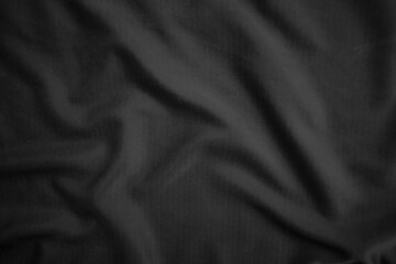 Background texture black cloth. Abstract dark wavy soft. Fabric is wrinkled. Fashion luxury style.