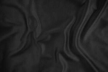 Background texture black cloth. Abstract dark wavy soft. Fabric is wrinkled. Fashion luxury style.