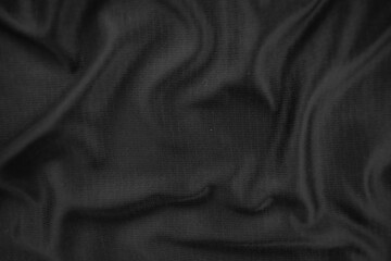 Background texture black cloth. Abstract dark wavy soft. Fabric is wrinkled. Fashion luxury style.