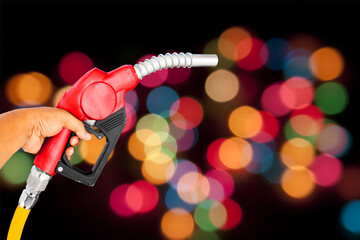 Nozzle red bokeh blur color fuel gasoline dispenser hand held separator