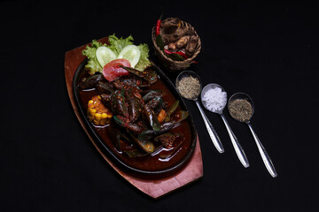 A Clam Dish With Padang Sauce