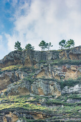 Fototapeta na wymiar Limestone cliff landscape with a cloudy sky