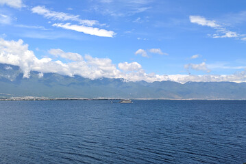 landscape of blue lake and blue sky with white clouds