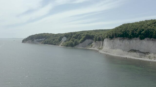 Drone Aerial Shot of the chalk cliffs on Ruegen R&uuml;gen in Germany in beautiful light with green and blue seawater, Europe