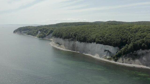 Drone Aerial Shot of the chalk cliffs on Ruegen R&uuml;gen in Germany in beautiful light with green and blue seawater, Europe