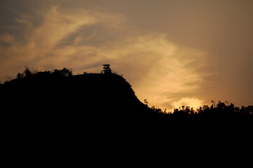 silhouette of a mountain at sunset