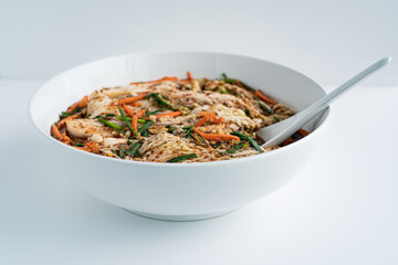 Close up traditional Korean dish kimchi in a white plate on a white background