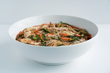 Close up traditional Korean dish kimchi in a white plate on a white background