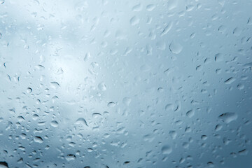 Rain drops on car window, Textures of water droplets of rain flow