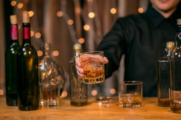 Waitress pouring whiskey glass customers sit drink