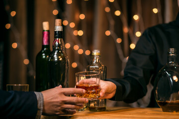 Waitress pouring whiskey glass customers sit drink