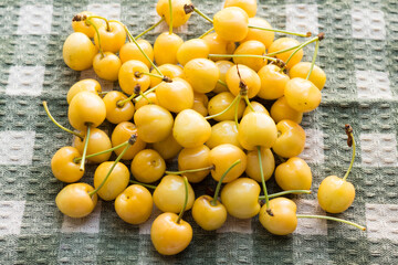 Yellow cherries, summer harvest on the table, summer unusual berries