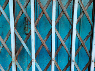 Rusty blue metal grille sliding door