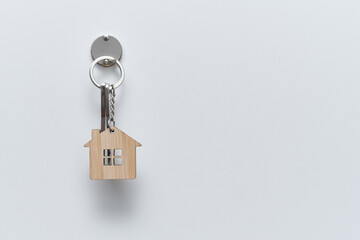 keys hanging on a wall, keychain of a house