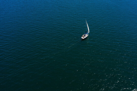 aerial view of a lonely white sailing yacht at sea © sergiy1975