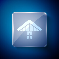 White Hang glider icon isolated on blue background. Extreme sport. Square glass panels. Vector Illustration.