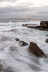 Strong current flowing between rocks.
