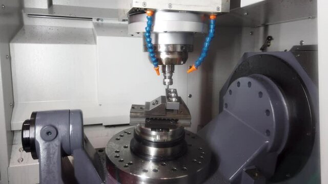 Precision milling CNC machine tool makes part.