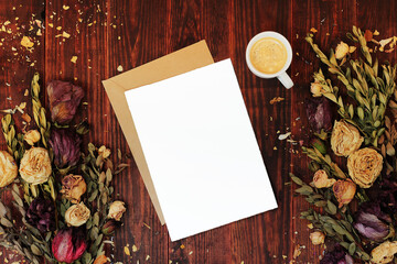 Paper card mockup with envelope on wooden table