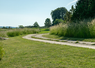 Naklejka premium summer landscape with a simple rocky road along the sea shore