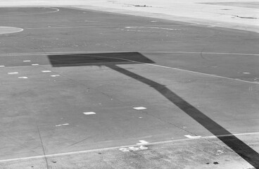 Basketball hoop shadow on a colored playground field (Pesaro, Italy, Europe)