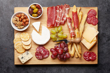 Cheese, meat, grapes and olives antipasto