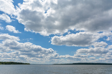 white cumulus clouds on a blue sky on a sunny day