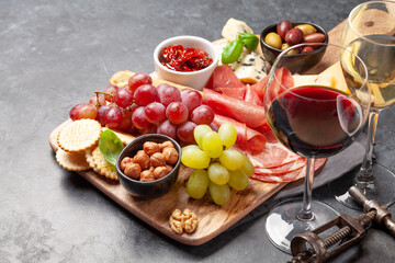 Cheese, meat, grapes and olives antipasto