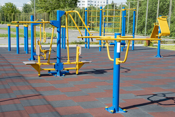 Urban outdoor sports ground with weight training equipment for sports. Sports and recreation area.