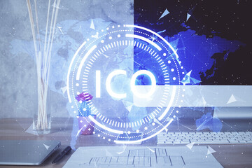 Double exposure of blockchain and crypto economy theme hologram and table with computer background. Concept of bitcoin cryptocurrency.