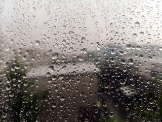 Close up rain drops on  plastic background.Water drops on window glass.