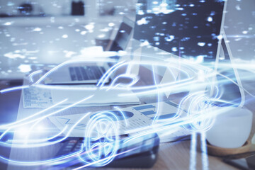 Obraz premium Desktop computer background in office with automobile hologram drawing. Multi exposure. Tech concept.