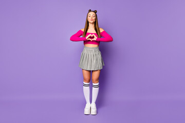 Full length photo of funny adorable lady making heart shape fingers send kisses wear pink off-shoulders cropped top skirt long socks shoes isolated pastel purple color background