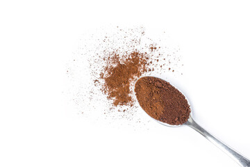 Instant coffee dust powder in stainless teaspoon with coffe beans isolated on white background. Top...