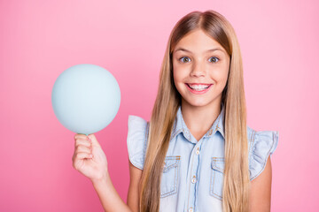 Close-up portrait of her she nice attractive lovely pretty funny girlish charming cheerful cheery preteen girl holding in hands decorative air ball isolated over pink pastel color background