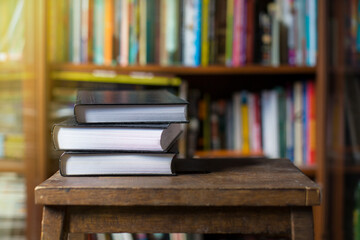 Books in a row near bookshelf . Library. Knowledge and wisdom from reading.